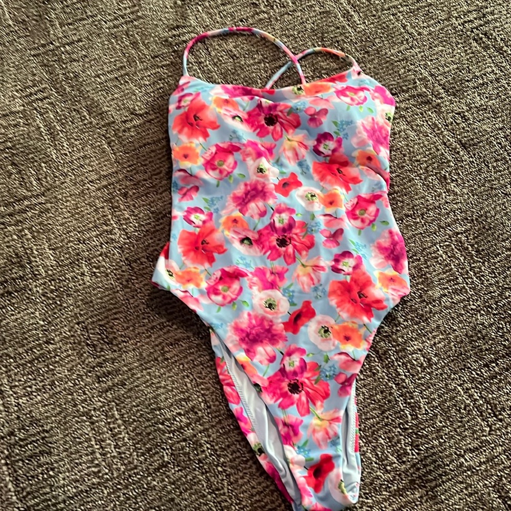 Victoria’s Secret flowered. Small adjustable tie strap that crisscross.